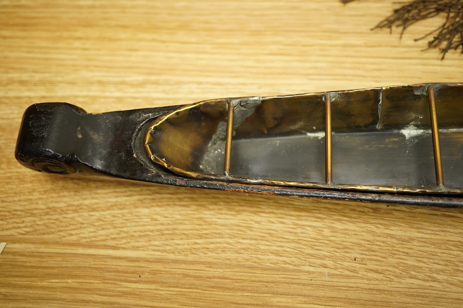 A Chinese export lacquer model of a boat, 19th century, 56cm wide